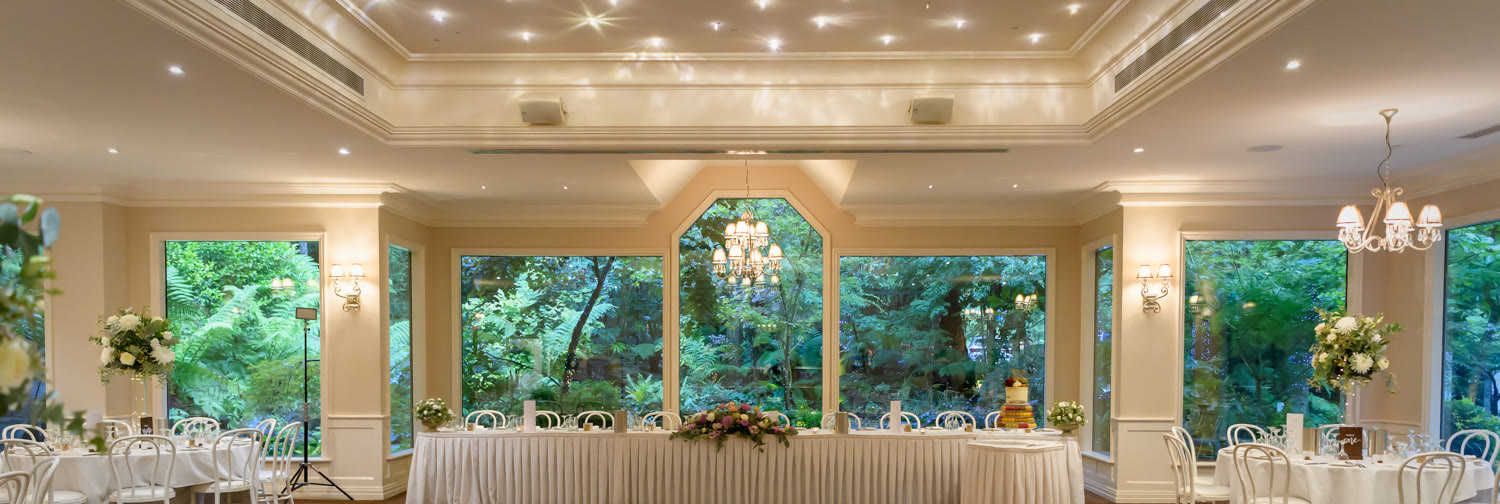 The reception room set for a wedding dinner.